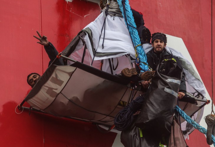 Activists with Greenpeace occupy a portaledge hanging from the side of Gazproms Arctic oil platform, Prirazlomnaya, off the North-eastern coast of Russia in the Pechora Sea on August 24, 2012. Photo: Denis Sinyakov/Greenpeace