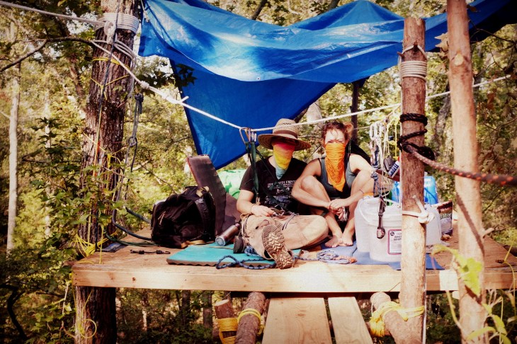 Activists with the Tar Sands Blockade occupy platforms and scaffold constructed in the path of TransCanada’s planned Keystone XL pipeline construction. September 2012. Photo: Laura Borealis