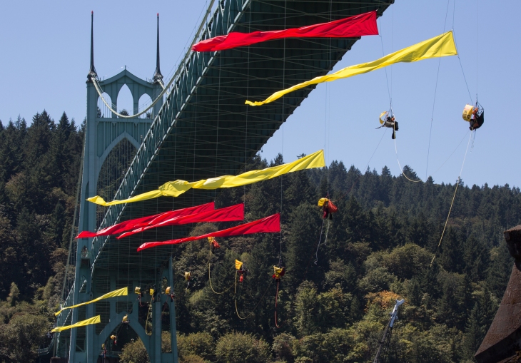 Climbers suspend themselves under the St. Johns Bridge in Portland, OR and join kayaktivists in an effort to block the Shell leased icebreaker, MSV Fennica from meeting with the rest of Shell’s Arctic drilling fleet on July 29, 2015. Photo: Tim Aubry/Greenpeace